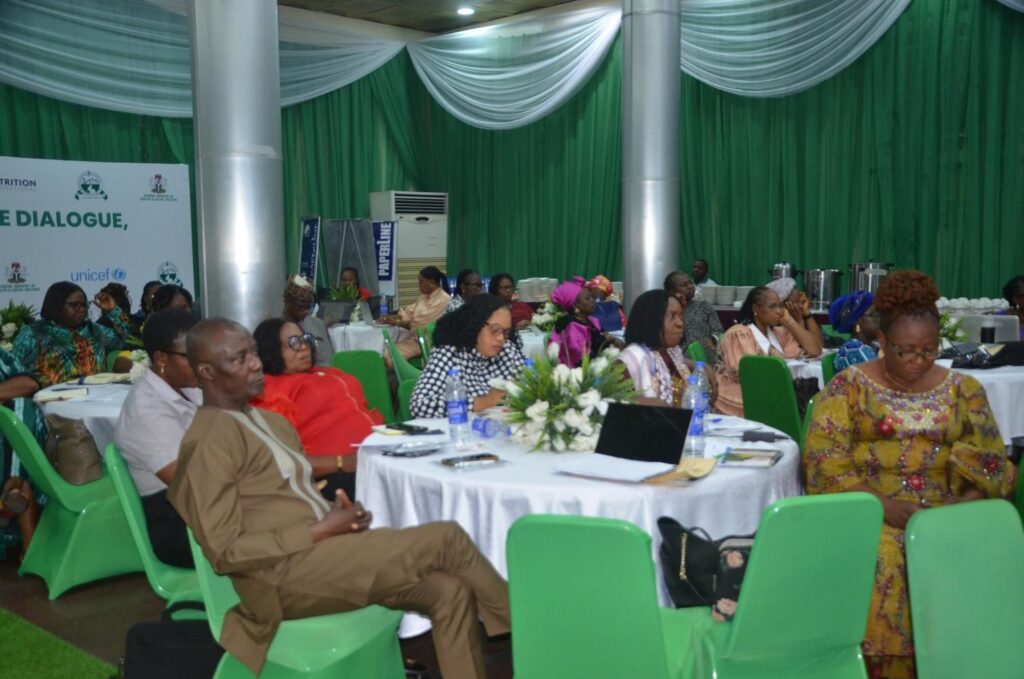 Policymakers seated at tables during a nutrition breakfast meeting